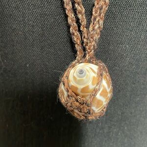 Crocheted metallic yarn and seashell necklace. Hand made